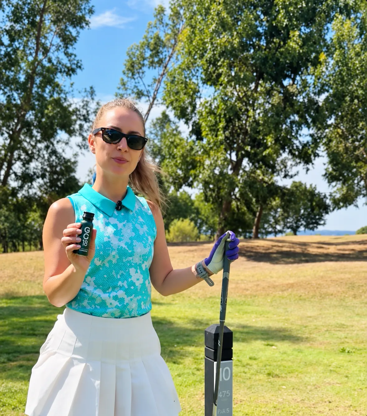 Golfer holding GC18 on the course